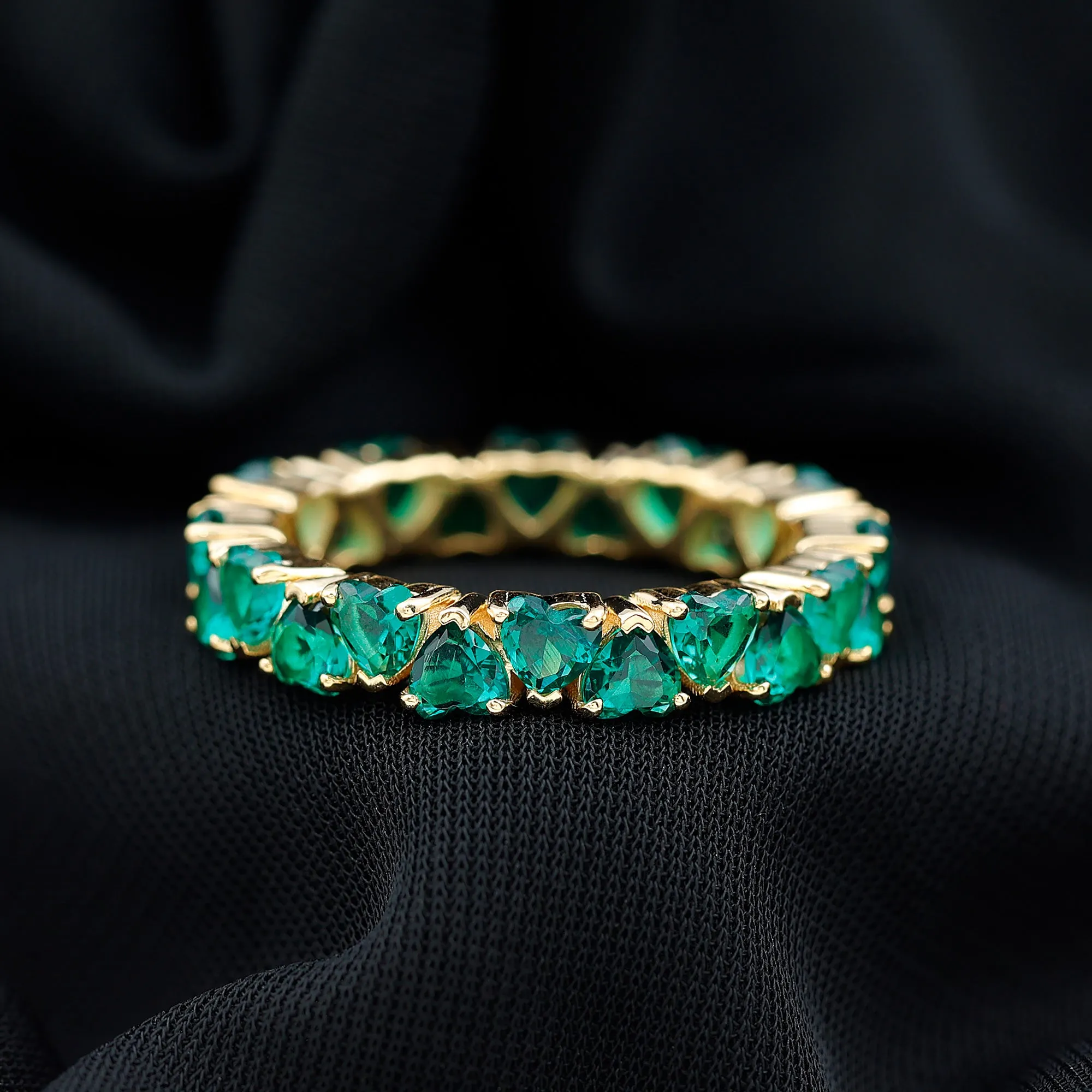 Claw Set Lab-Created Emerald Heart Eternity Band Ring in Gold