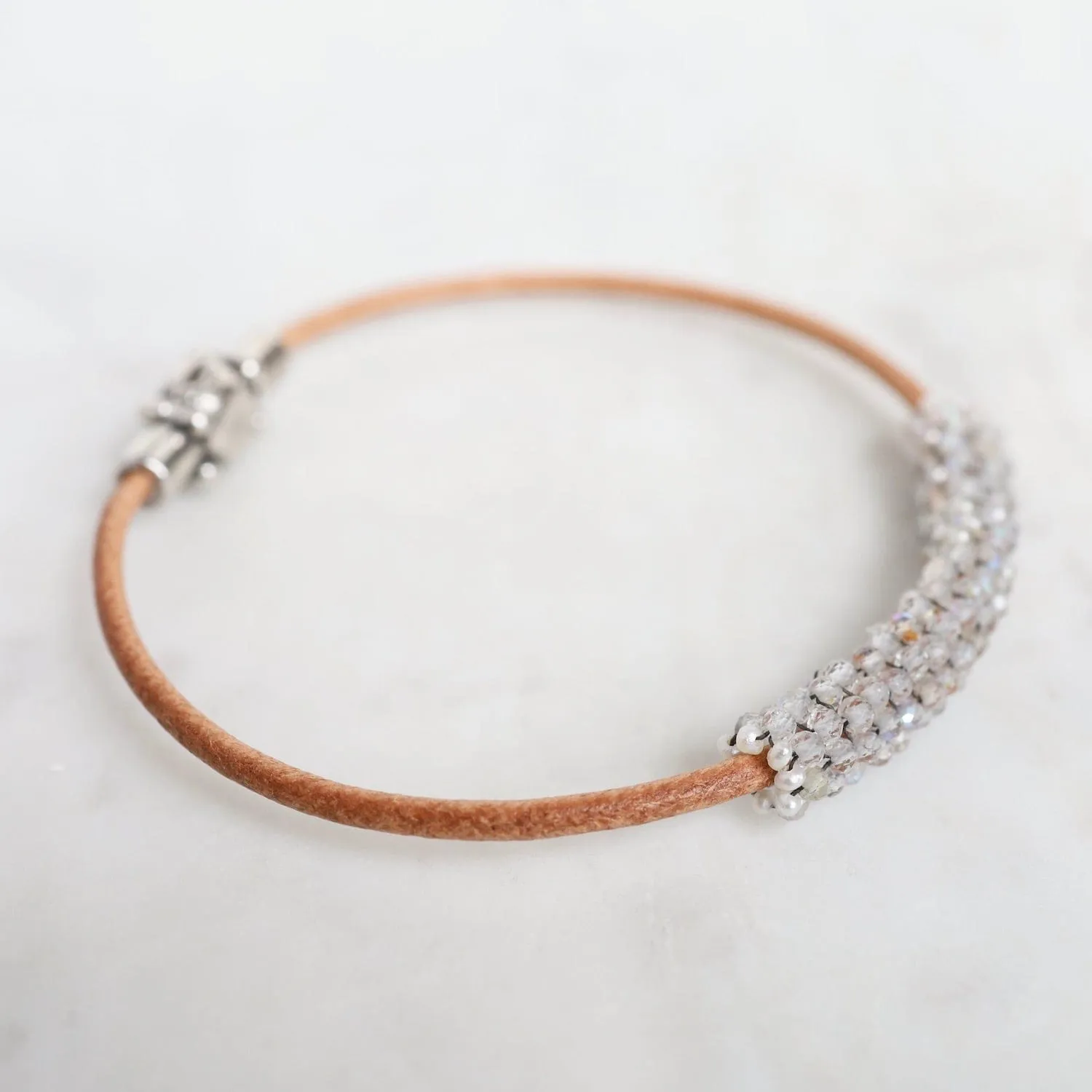 Hand Stitched Sparkly Topaz with Tiny White Pearl Trim on Natural Leather Bracelet