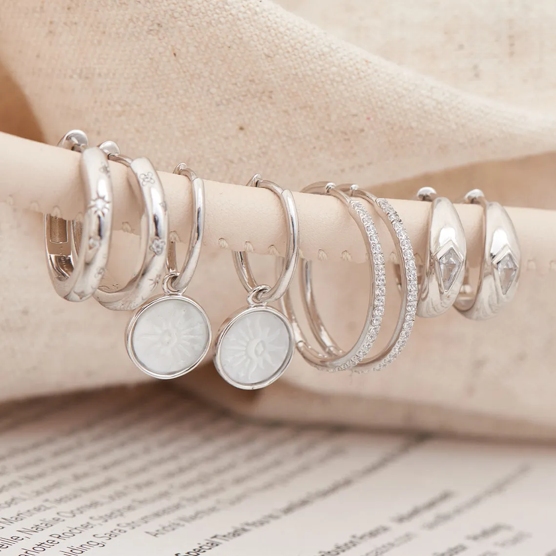 Sunbeam Emblem Silver Huggie Hoop Earrings